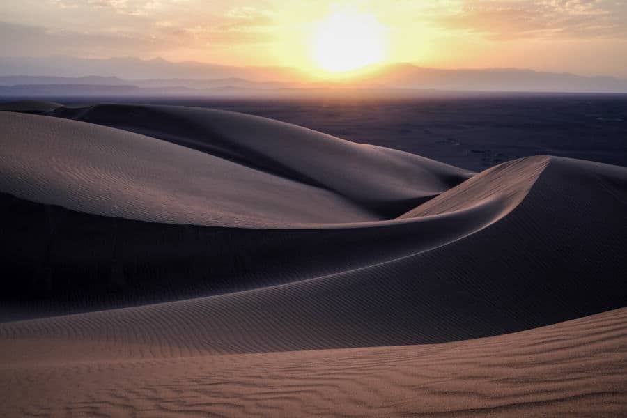 Sunset in the sand dunes in the Lut desert