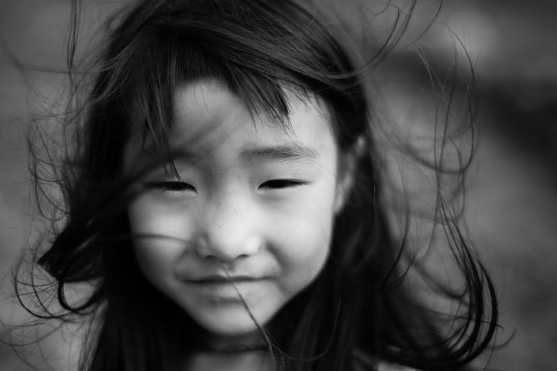 An up close portrait of Hmong girl in black and white taken in North Vietnam - Pics Of Asia Photos Travels Tours