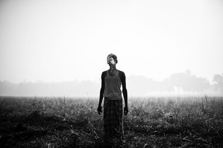 Bangladeshi farmer taking a cigarette break