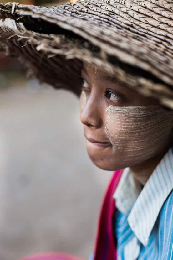 Close up portrait of a young Burmese woman in the streets of Nyaung Shwe during a Pics of Asia photography tour