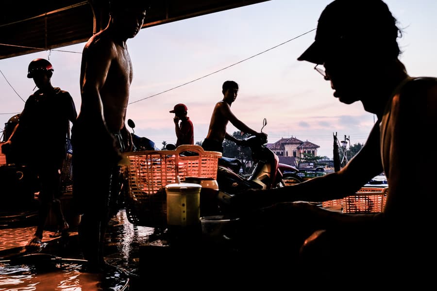 Men selling fresh fish in the wet market of Sa Dec in Vietnam's Mekong Delta