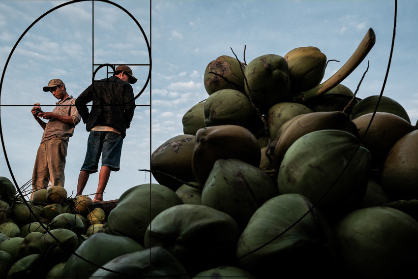 Showing the golden ration in composition with an image of men selling coconuts in Long Xuyen floating market in Vietnam