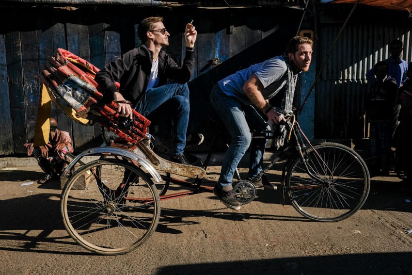 Photographers Etienne Bossot and Drew Hopper on a rickshaw while running a photography tour in Bangladesh for Pics of Asia