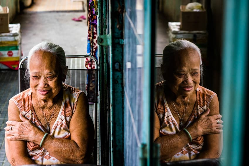 A creative portrait of an old Vietnamese woman. Photo by Quinn Ryan Mattingly