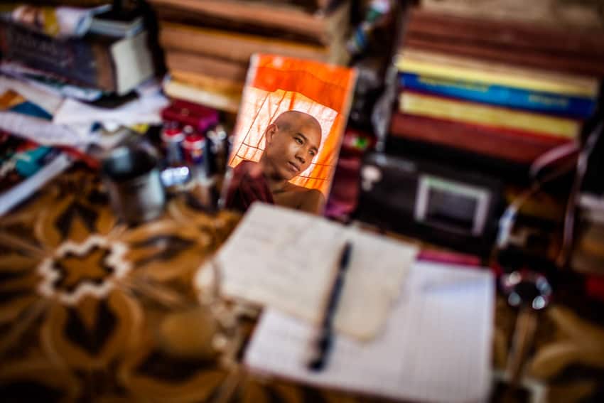 Using reflections for creative portraits, photo of a monk in Myanmar by Quinn Ryan Mattingly for Pics of Asia website