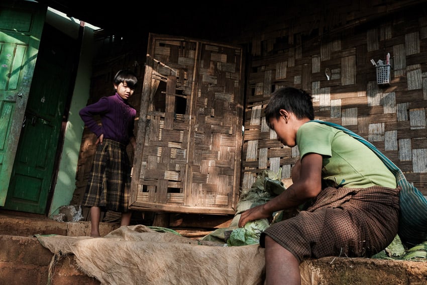 Two children playing outside their Pao village in Pindaya, Myanmar