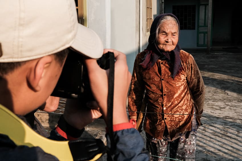 a student from an international school learns about portrait photography in Vietnam with Pics of Asia