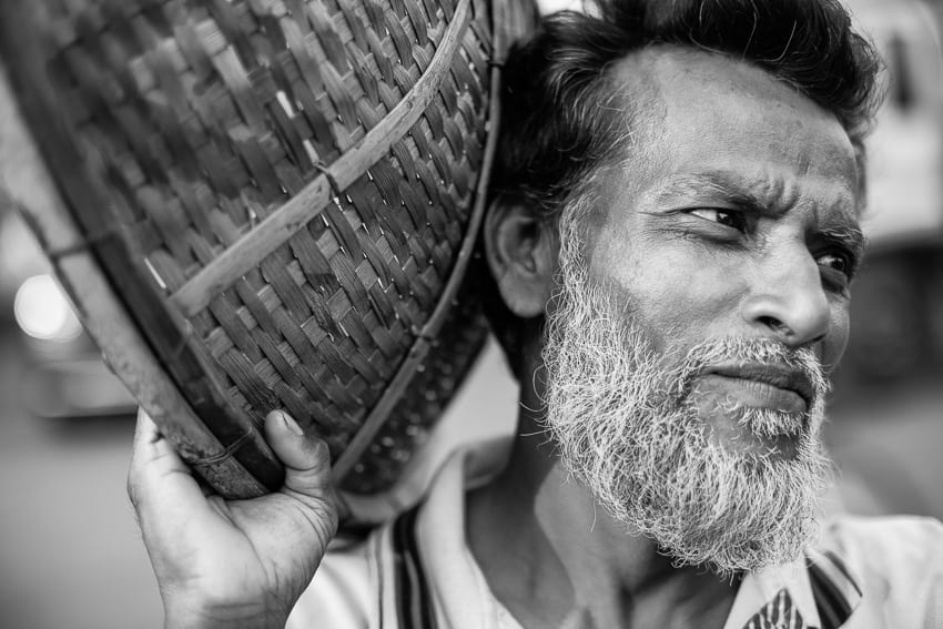 Portrait of a man carrying vegetables in Sylhet market