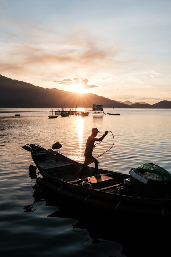 A fisherman prepares to go at sea on Lang Co lagoon in vietnam