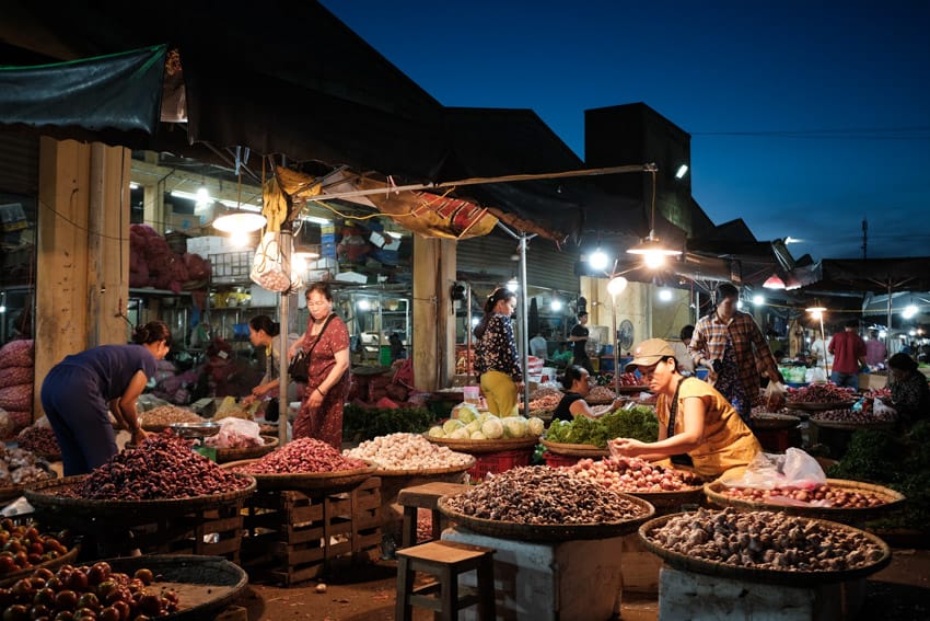 taking photos of the night market in Hue on a pics of asia photo tour