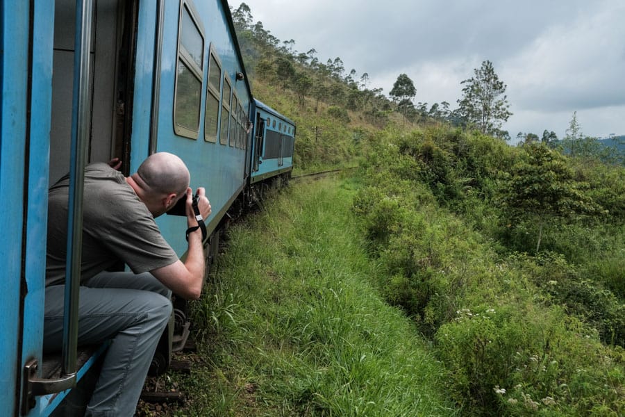 Photographer on the train ride between Kandy and Nurawa Eliya in Sri Lanka