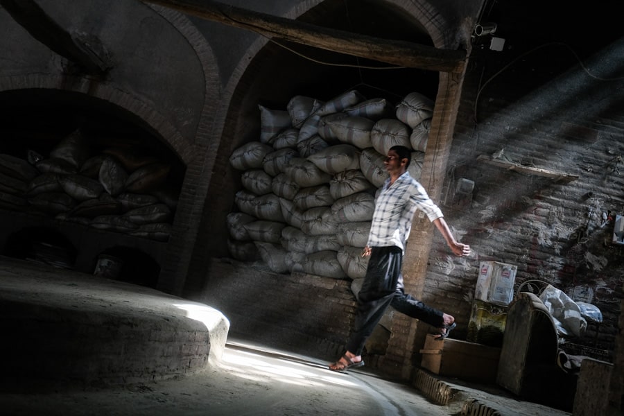 Man working in a Henna factory in Yazd, Iran