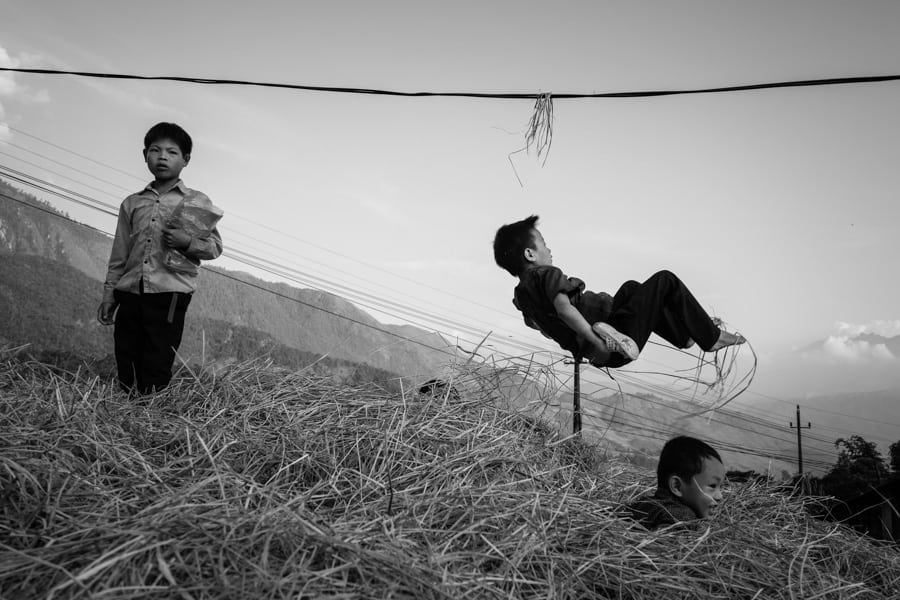 Street photography of children playing in Vietnam