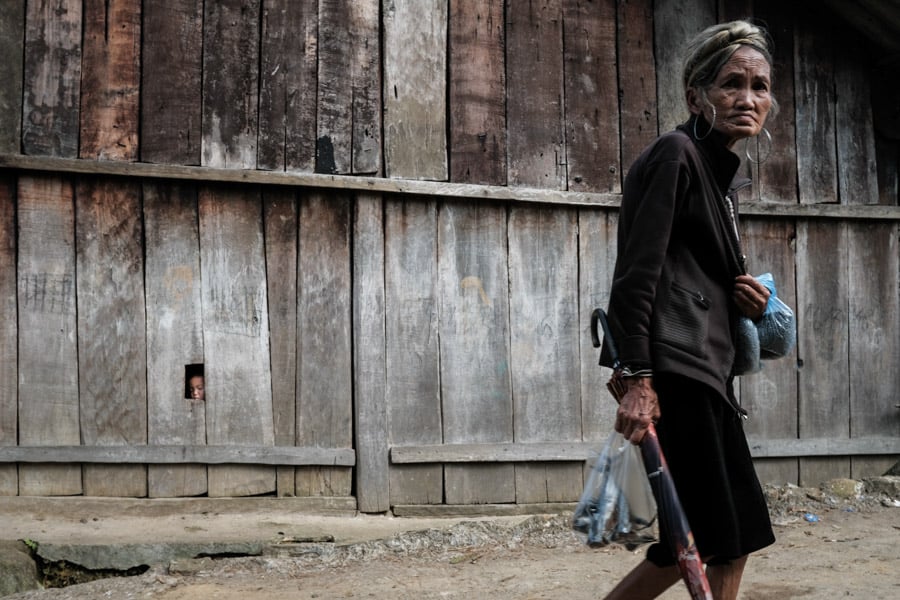 Hmong woman walking in a village in Vietnam