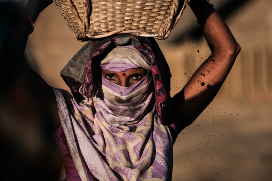 Women carrying coal in a brick factory near Sylhet in Bangladesh