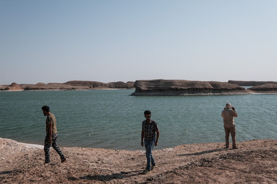 People visiting the salt lake in the Lutz desert in Iran