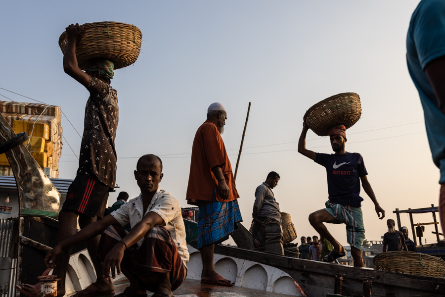 Barisal fishermen unloading fish in the market